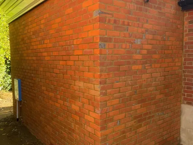 New red brick extension with a traditional moulded cornice.